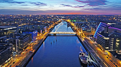 A view of a river running through a city at night