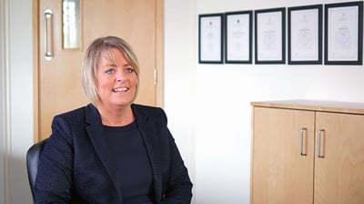 A businesswoman sitting in her office